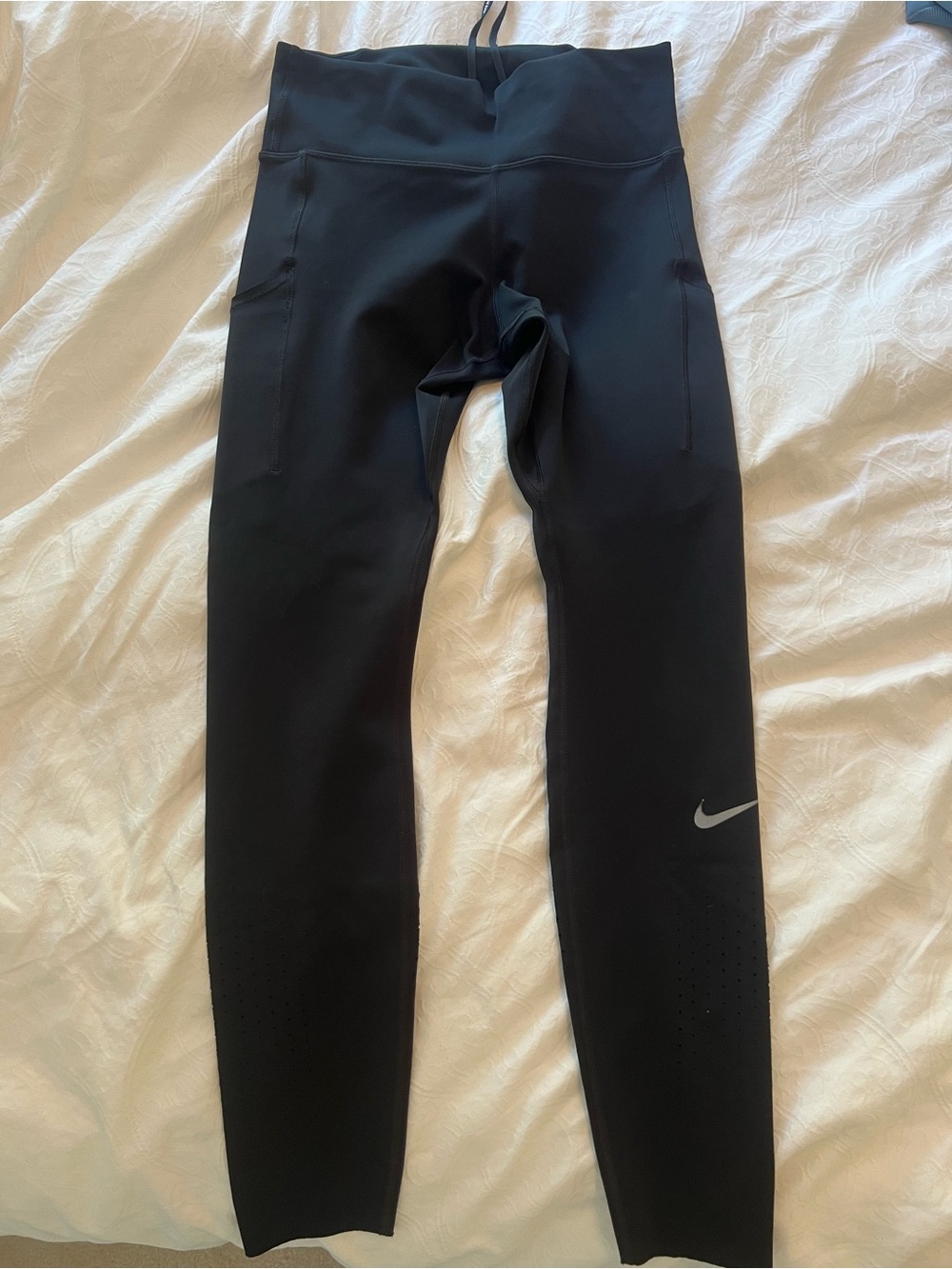 Nike Kids Black Performance Leggings with Side Pockets and Reflective Swoosh
